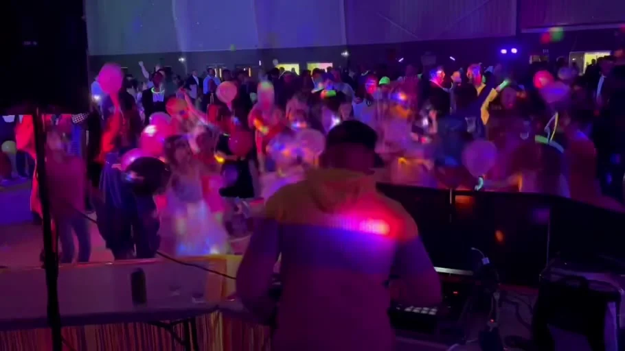 A view from behind the DJ booth toward the dance floor